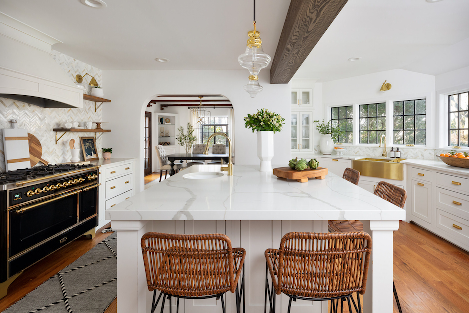 white kitchen with island and gold sink