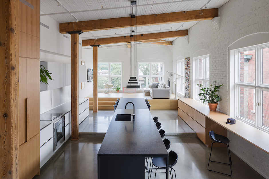 urban loft kitchen with exposed wood beams