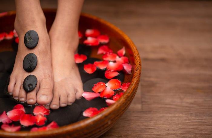 feet soaking in bowl of water