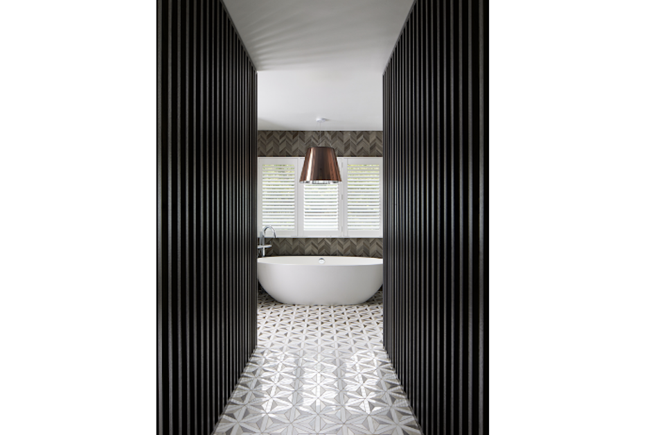 entrance to primary bath framing tub