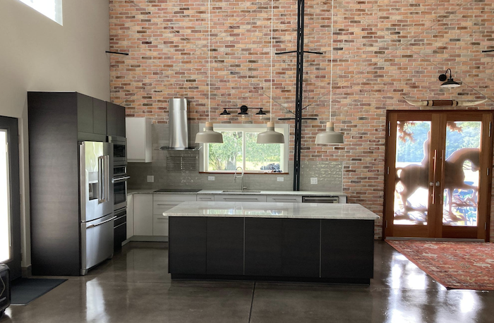 kitchen with brick wall