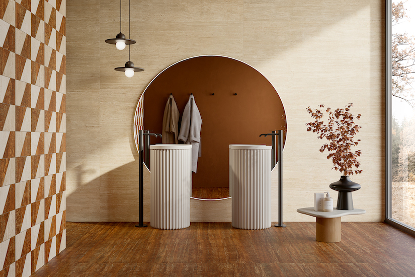 bathroom scene with tile walls and two pedestal sinks