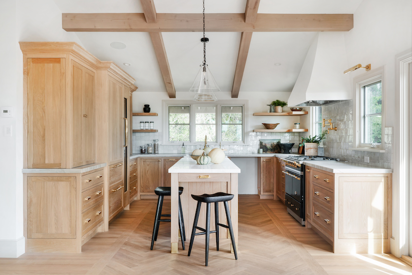 kitchen with beamed sloped ceiling and center island