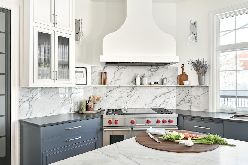 plaster range hood over range on angled kitchen wall