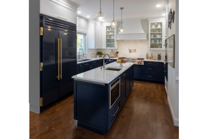 blue true refrigerator in kitchen with blue cabinets