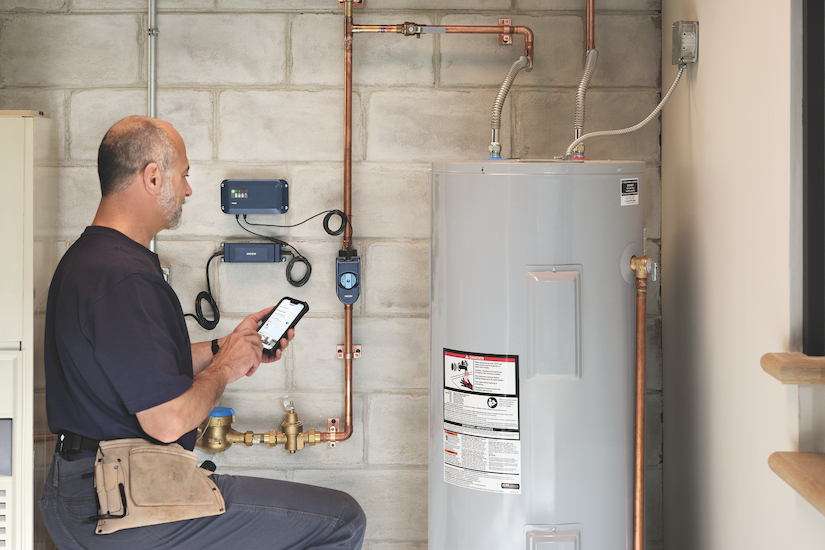 man installing a residential water flow meter