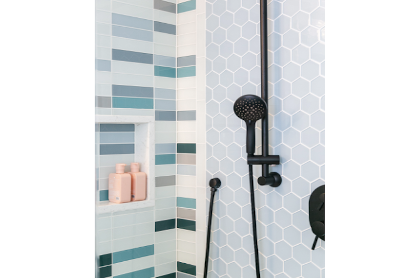 shower walls with blue hex and subway tiles