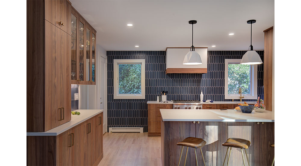 kitchen with blue tiled wall and walnut cabinets