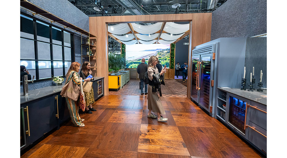 KBIS 2024 attendees at an exhibitor booth.