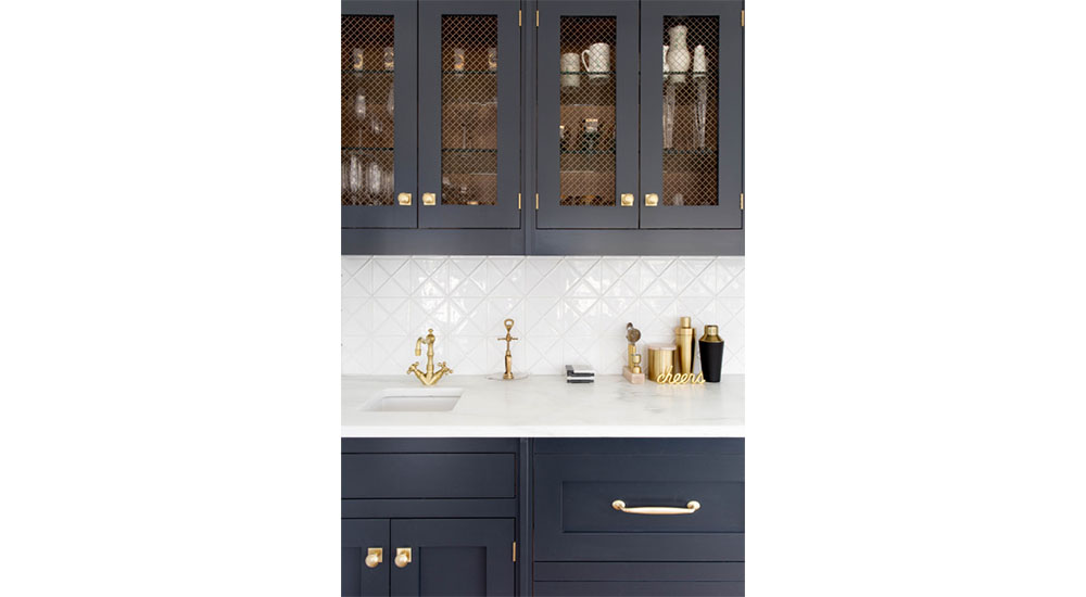 glass-front cabinets with decorative metal screens