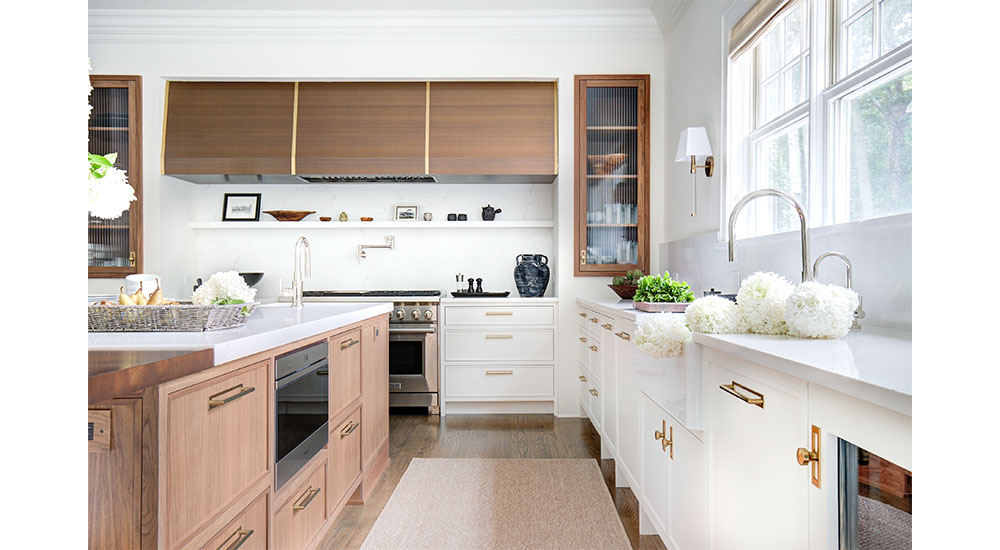 hamptons style kitchen with white and wood cabinets