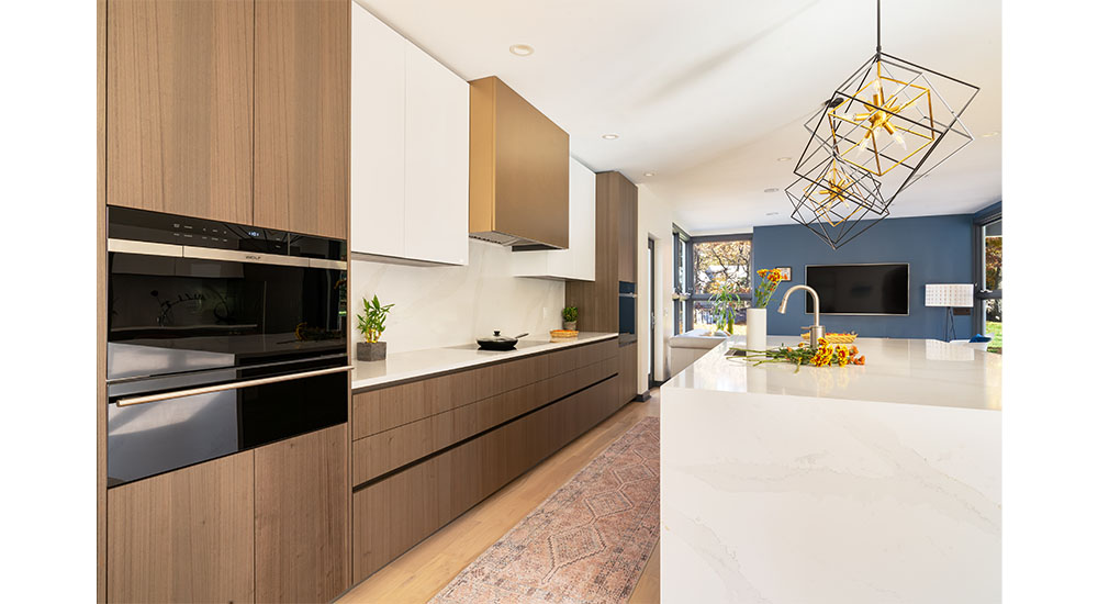 gold range hood in modern kitchen