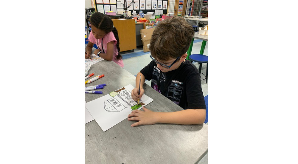 kids drawing homes for Neal communities