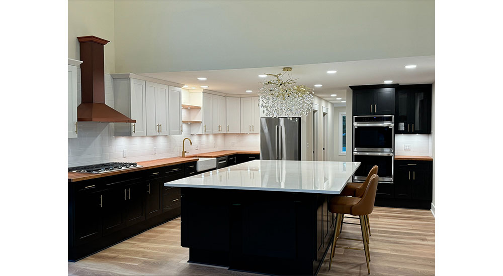 kitchen with black cabinets and island with white countertop