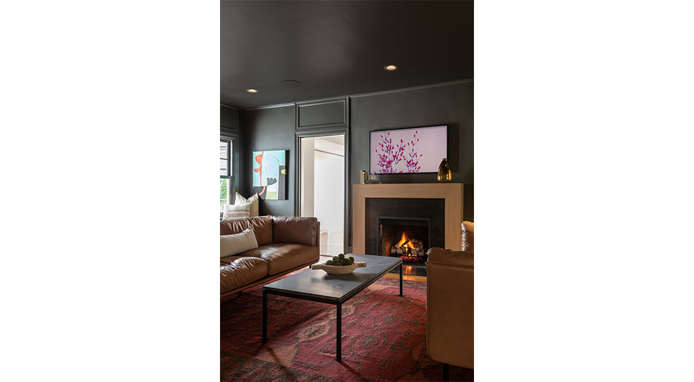 dark green color drenched living room with fireplace