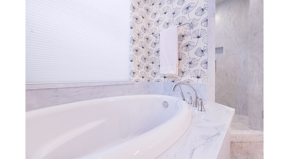 bathtub detail with wallpaper and marble deck Kathleen jennison design