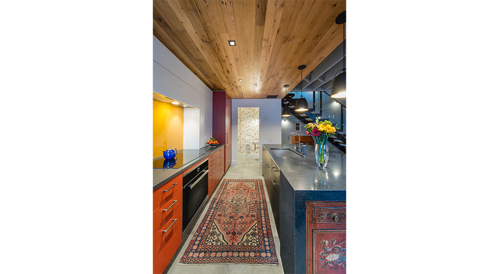 remodeled carriage house kitchen with red color cabinets