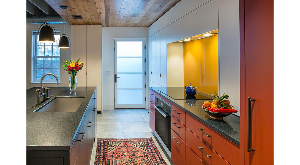 colorful galley kitchen with island