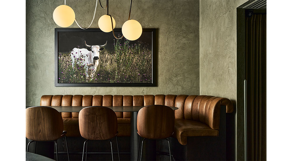 corner banquette upholstered in brown leather