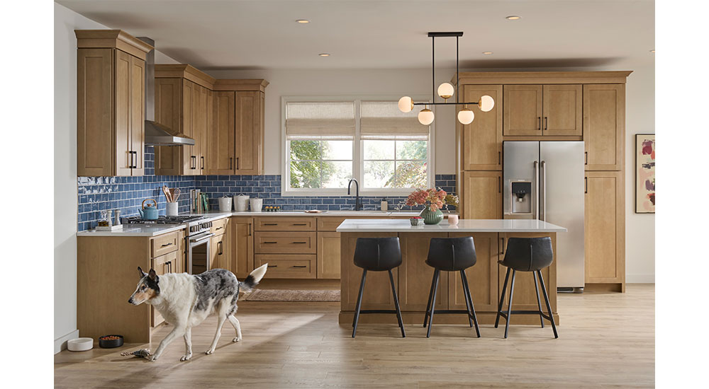 The Sandlewood stain finish on Classic Grove cabinetry creates an inviting space families will love for years to come.