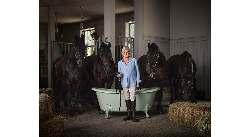 Martha Stewart with kohler cast iron tub and horses in stable