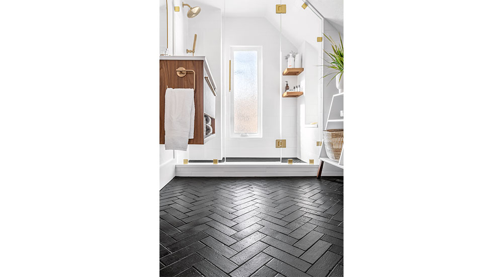 herringbone floor in sloped ceiling bathroom