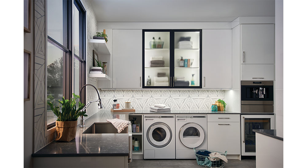 laundry room with undercounter and in cabinet lighting