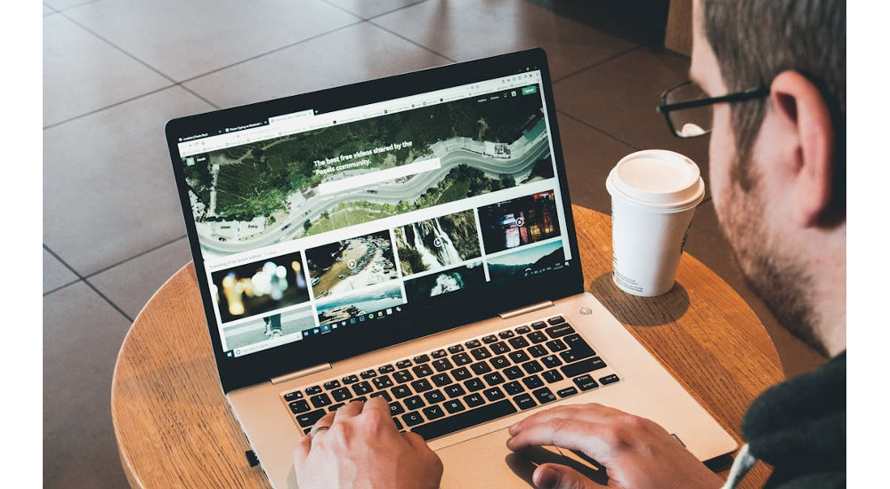 man using laptop design portfolio