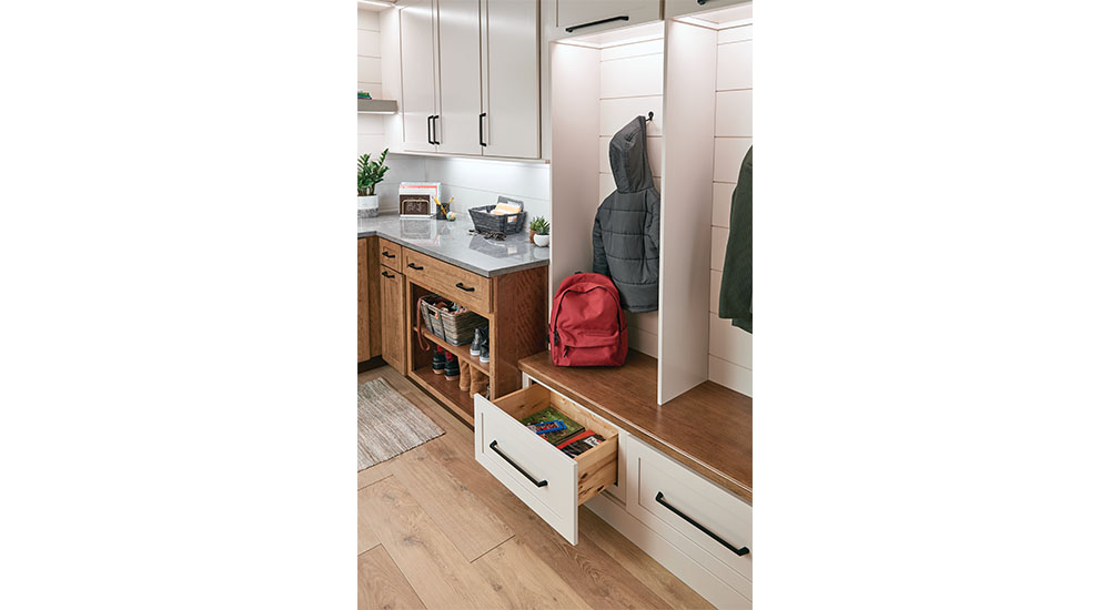 mudroom with drawer storage and coat hooks