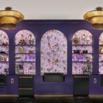 kitchen with purple cabinets and open shelving wallpaper black appliances