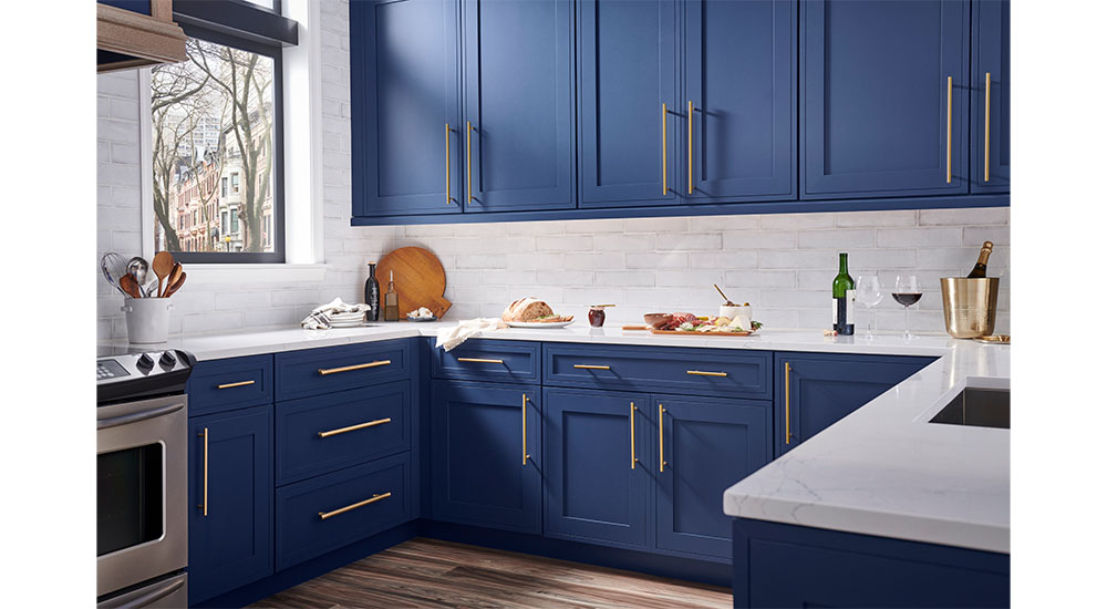 warm metallic hardware finishes kitchen design trends