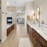 living in place primary bath with tub and shower and vanity