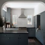 modern small kitchen dark blue cabinets