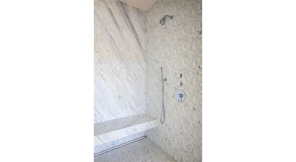 stone shower with bench and tile