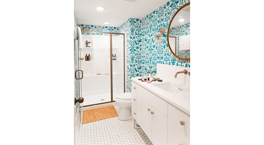 white bathroom with blue print wallpaper jenny marrs